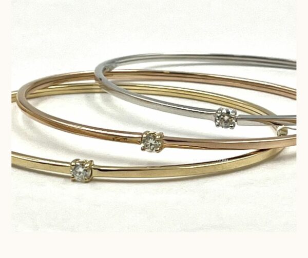 BRACCIALE RIGIDO IN ORO GIALLO CON DIAMANTE