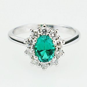 ANELLO IN ORO CON DIAMANTI E SMERALDO